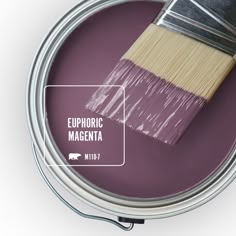 a can of smokey mulbberry paint with a brush