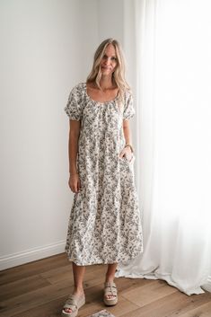 The Another Love Floral Casual Midi Dress is a beautiful and versatile piece perfect for any occasion. This dress features a flattering midi length that falls just below the knees, making it ideal for both casual outings and slightly more formal events. The floral pattern adds a touch of femininity and charm, while the casual silhouette ensures comfort and ease of movement. Fabric: 100% Polyester Product Details: True to size. Model shown wearing a small. Mid length sleeves. Floral pattern. Spring Maxi Dress With Relaxed Fit, Relaxed Fit Midi Length Maxi Dress For Spring, Cotton Midi Knee-length Dress For Day Out, Knee-length Cotton Midi Dress For Day Out, Cotton Knee-length Midi Dress For Day Out, Knee-length Sundress For Garden Party, Spring Cotton Midi Dress, Floral Print Cotton Midi Dress, Relaxed Fit Midi Dress For Spring Garden Party