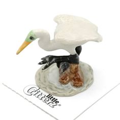 a figurine of a stork on a plate