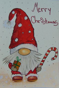 a christmas card with a gnome holding a candy cane