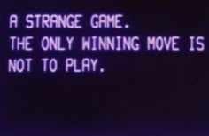 a neon sign that reads, a strange game the only winning move is not to play