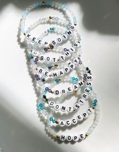 "A beautiful bracelet to display names of loved ones or words that are meaningful to you. These gem bracelets shimmer in the light and look so beautiful on! This bracelet is made with clear bicone crystal \"gem\" beads and 1 color gem bead of your choice. So many possibilities to make a bracelet that is unique to you!  Please indicate which ONE color gem and the name/ word you would like on your bracelet at checkout. At most, 2 color gem choices can be used (in place of clear) for this style bracelet. You can also choose if you would like gold or silver spacer beads. Filled or open heart bead options available too. Please refer to pictures for all color options :) I love jewelry that is personal and tells a story. Let me know how I can personalize pieces for you! - need a special size you Adjustable White Crystal Beaded Bracelets, Personalized Inspirational Silver Beaded Bracelets, Inspirational Personalized Silver Beaded Bracelets, Inspirational Hypoallergenic White Name Bracelet, Inspirational White Hypoallergenic Name Bracelet, White Crystal Bracelet With Letter Beads For Friendship, Clear Beaded Crystal Bracelet As Gift, Adjustable Clear Beaded Spiritual Bracelets, Clear Beaded Crystal Bracelet Gift