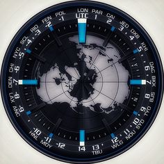 a black and white clock with blue arrows on it's face shows the time