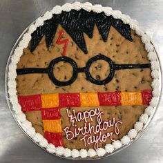 a birthday cake decorated with a harry potter theme