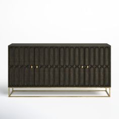 a black cabinet with gold handles on the top and bottom, against a white background