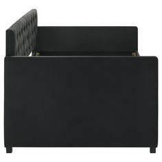 an upholstered black couch with gold accents on the arm and backrests