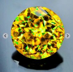 a yellow diamond sitting on top of a table