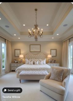 a bedroom with a bed, chair and chandelier in the middle of it