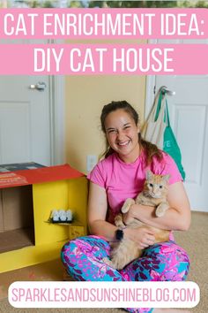 a woman sitting on the floor holding a cat with text overlay that reads, cat enrichment idea diy cat house