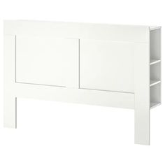 a white headboard with two shelves on each side