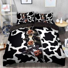 black and white cow print bedding set with two pillow cases on the bottom side