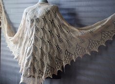 "Triangle shawl shoulder cape versatile accessory, perfect for adding a touch of charm to the winter wedding or any other occasion. Shawl hand knit from soft and cozy merino wool lace can be a great anniversary gift, gift for wife, or Mother Day gift. This wedding shawl bride ready to ship in sage green, emerald green, beige and teal blue colours, other colours (black, brown) available! * Leaf shawl has  length is about 39,3\"(100cm ) and width 86.6\" (220cm)  Wool wrap be worn draped over your shoulders or wrapped around your neck like a large triangle scarf, this beige shawl indispensable accessory for the cottagecore outfits *Care instructions-hand wash in warm water, lay flat to dry" Elegant Hand Knitted Cream Shawl, Cream Hand Knitted Shawl For Winter, Winter Cream Hand Knitted Shawl, Handmade Cream Shawl For Winter, Bohemian Cream Knitted Shawl, Cream Knitted Shawl One Size, One Size Cream Knitted Shawl, Cream Knitted One Size Shawl, Handmade Beige Shawl For Wedding