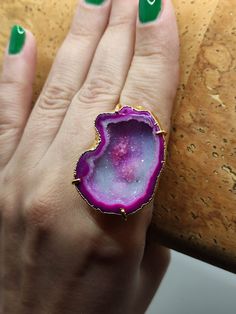 Introducing our stunning Geode Rings - nature's hidden treasures transformed into exquisite jewelry! Each Geode Ring showcases the unique beauty of geodes, with their captivating crystals and vibrant colors. Elevate your style and connect with the Earth's natural wonders. Discover the magic of geodes with our Geode Rings today! 🔸Adjustable band ring  🔸30mm stone size 🔸Color may vary according to lighting 🔸Gold filled We offer  🔸Fast shipping  🔸Free shipping eligible orders 🔸Polishing cloth  🔸Free item for orders above 100€ 🔸Gift box 🎁 🔸Great customer service  Geodes: Nature's hidden gems, revealing breathtaking crystals inside. Adorn yourself with our Geode Rings to capture their natural beauty Unique Open Ring With Raw Stone, Unique Round Gemstone Geodes, Unique Crystal Open Ring With Stone Setting, Agate Gemstone Open Ring Jewelry, Agate Open Ring Jewelry, Agate Open Ring Gift, Agate Jewelry With Natural Stones In Open Ring Shape, Agate Open Ring For Gift, Agate Gemstone Open Ring