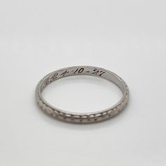 A fine Art Deco period band ring.  In platinum.  With alternating engraved diamond and circle decoration around the band.  Simply a wonderful period wedding ring!  Date: Early 20th Century  Overall Condition: It is in overall good, as-pictured, used estate condition.  Condition Details: There is some rubbing and high point wear to the engraved decoration. Otherwise, there are some fine & light surface scratches and other signs of expected light wear consistent with age.  Fineness: Marked PLATINU Period Wedding, Blossoms Band, Art Deco Period, Antique Art Deco, High Point, Orange Blossom, Antique Art, Early 20th Century, Band Ring