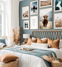 a bed room with a neatly made bed and lots of pictures on the wall above it