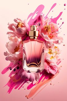 a pink perfume bottle surrounded by flowers and paint splatters on a pink background