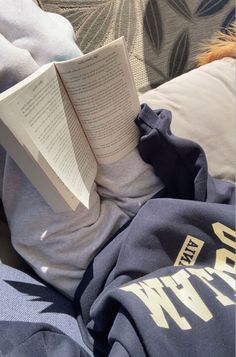 an open book laying on top of a couch