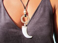 "womens boho Leather necklace with bohemian silver horn pendant, long bpho pendant necklace, boho necklace, boho jewelry, long necklace, necklaces for women, long necklaces, bohemian necklaces, silver necklaces, summer jewelry, etsy jewelry. An everyday fashion jewelry !! original handmade designs by kekugi. This necklace is made of genuine leather and silver plated beads. All silver pieces are subjected to an anti-allergic process ( nickel and lead free) with a silver plating of 8 microns of st Bohemian Long Metal Pendant Necklace, Adjustable Hand-strung Bohemian Necklaces, Bohemian Hand-strung Long Necklace, Necklaces Summer, Bohemian Black Leather Necklace, Boho Leather Necklace, Jewelry Long Necklace, Horn Necklace Boho, Horn Pendant Necklace