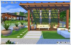 an outdoor living area with couches and potted plants