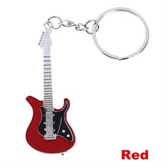 a red guitar shaped keychain on a white background