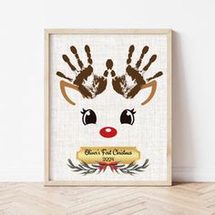 a deer's handprint is on the wall next to a wooden frame that reads,