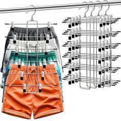 several pairs of shorts hanging on a clothes rack