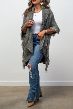 Conquer the unknown with our Adaline Knit Collared Cardigan/ Ruana. This luxurious, fashionable staple will keep you warm and stylish with its knit design and trendy fringe detail. Add a touch of boldness to your wardrobe and embrace the risk-taker within you! Chic Fringe Cardigan, Casual Winter Poncho With Tassels, Winter Knit Sweater With Tassels, Winter Shawl With Tassels, Casual Winter Sweater With Tassels, Chic Long Sleeve Fringe Cardigan, One Size Winter Outerwear With Fringe, Casual Shawl Cardigan For Spring, One Size Tassel Cardigan For Fall