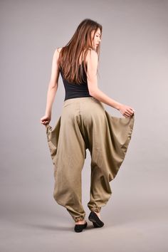 "Linen Harem Pants, Harem Trousers, Baggy Pants, Loose Pants. Extravagant harem trousers with interesting and unusual cut. The baggy pants are loose fit and feature drop crotch. The model is made of linen fabric so it is extremely comfortable women pants suitable for the daytime. If you are looking for the perfect addition to your casual outfit these loose pants are a great choice matched with flats or sneakers. ^ Sizes: The item can be made in sizes from XXS to 7XL. Please, use the size chart b Baggy Full-length Beige Pants, Baggy Wide Leg Khaki Pants, Baggy Khaki Straight Pants, Beige Baggy Wide-leg Harem Pants, Baggy Khaki Trousers, Beige Wide-leg Harem Pants, Beige Non-stretch Full Length Harem Pants, Baggy Khaki Ankle-length Pants, Stretch Wide-leg Harem Pants With Pockets