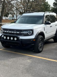 a white truck parked in a parking lot