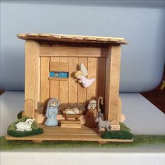 a nativity scene is displayed on a table