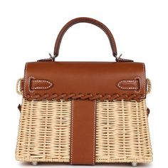 This rare Mini Picnic Kelly is in Fauve Barenia leather and Naturel Osier wicker with palladium hardware and has tonal stitching, two straps with toggle closure, single rolled handle and shoulder/crossbody strap.The interior is lined with Fauve Barenia leather and has one slip pocket.Collection: YOrigin: FranceCondition: Pre-owned; Mint - This bag retains its shape structure. The exterior leather is clean with no signs of wear. There is some overall darkening to barenia leather but it is clean. Kelly Sellier, Hermes Birkin 25, Hermes Box, Birkin 25, Brown Beige, Crossbody Strap, Backpack Bags, Mint Condition, Dust Bag