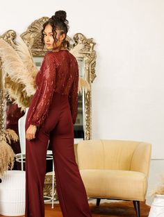 Be the life of the party in this fringed jumpsuit! Fringe Sleeves Exposed Back Wide Legs Has Stretch Model is wearing a medium Model is 5'10 Sequined Jumpsuits And Rompers For Evening In Fall, Glamorous Evening Jumpsuits For Fall, Long Sleeve Sequined Jumpsuits And Rompers For Date Night, Long Sleeve Sequined Jumpsuits And Rompers For Party Season, Glamorous Jumpsuits And Rompers For Holiday Party, Long Sleeve Sequined Jumpsuits For Party Season, Long Sleeve Sequin Jumpsuits For Date Night, Glamorous Jumpsuit For Holiday Party, Chic Jumpsuits And Rompers For Holiday Party