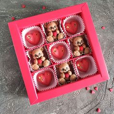 a box filled with heart shaped chocolates and teddy bears