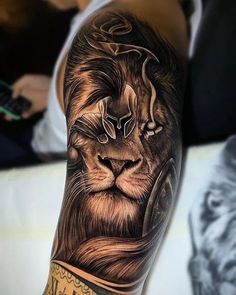 a man with a lion tattoo on his arm