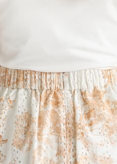 With it’s eyelet lace detail and soft floral pattern, the Annette Eyelet A-line Skirt is a beautiful a-line skirt with a flat front waist and elastic back! This skirt is fully lined with white eyelet lace and a cognac brown floral pattern. Pair this beautiful modest skirt with a t-shirt or sweater in any season. She is grace, beauty and style all in one! Style | A-line, Maxi Color | Cream, Cognac Brown SIZING TIPS Fit | Semi-Fitted Stretch | Mid-Stretch Model | True to Size Flowy Lace Trim Midi Skirt, Spring Lace Full Skirt, Lace Full Skirt Bottoms For Spring, Lace Full Skirt For Spring, Feminine Lace Flowy Skirt, Lace Tiered Relaxed Skirt, Spring Broderie Anglaise Bottoms For Daywear, Summer Midi Skirt With Lace Trim, Daywear Mini Skirt With Lace Trim