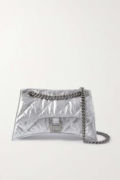 The gently curved silhouette of Balenciaga's 'Hourglass' bag is inspired by the house's '50s tailoring. Made from silver leather, this version is crinkled and quilted for softness and has an understated tonal strap that can be doubled up for a shorter drop. Luxury Quilted Party Bag, Heeled Rain Boots, Balenciaga Women, High Heel Rain Boots, Quilted Shoulder Bag, Metallic Bag, Lingerie Bag, Balenciaga Bag, Backpack Tote Bag