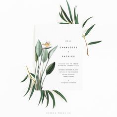 a wedding card with greenery on it