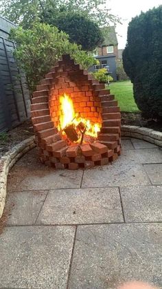 an outdoor fire pit made out of bricks