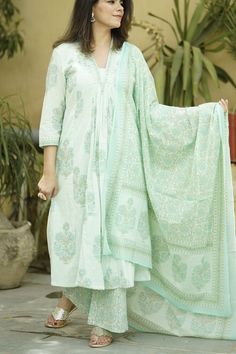 This beautiful  Handblock Kurta suit  set with Dupatta is the most comfortable and classy Indian outfit. Soothing pastel green color cotton fabric in this Jaipuri block print makes it very elegant. The pants a comfort fit with elastic band that makes the pants roomy. 3/4th sleeves and A line kurta with pockets  make it comfortable to wear for long hours , can be accessorised and worn at occasions . Specially handmade with love for you by the local Artisans of Jaipur , Rajasthan , India !  Size c Pastel Green Salwar Suit, Cotton Block Print Suit Designs, Hand Block Printed Suits, Jaipuri Print, Kurta Set With Dupatta, Block Printed Suits, Print Block, Indian Salwar Kameez, A Line Kurta