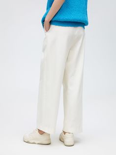 Details: Classic white carrot trousers High-waisted design with pinched pleats at the waist Invisible side pockets Materials & Care: Cotton 100% Hand wash | Dry clean Do not bleach Size & Fit: Model is 5'7", Bust 32, Waist 24, Hips 35, wearing a size S Item #: SN1PA50 Off White Straight Leg Work Bottoms, White Bottoms With Elastic Waistband For Work, Off White Straight Leg Spring Pants, White Elastic Waistband Bottoms For Work, White Wide Leg Pants With Welt Pockets, Off White Straight Leg Pants For Spring, White Straight Pants With Belt Loops, High-waisted Off White Pants For Work, Off White High-waisted Workwear Pants