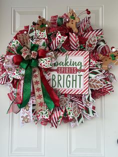 a christmas wreath on the front door with saying baking is bright and decorated with candy canes