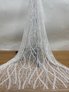 an artistic sculpture made out of white thread