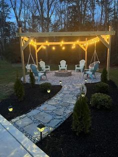 an outdoor patio with chairs and string lights on the pergolated area at night