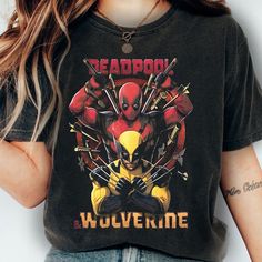 a woman wearing a deadpool wolverine t - shirt