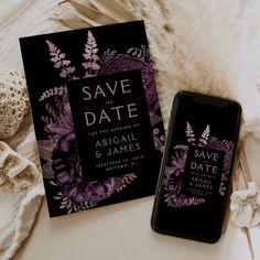 two wedding save the dates cards next to an iphone