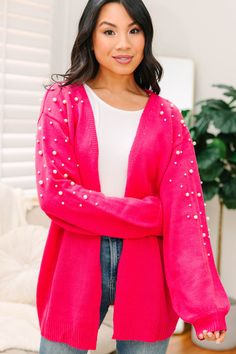 We can't help but love this pearl embellished cardigan! Just look at it! Those little pearls are just so cute and girly! The vibrant coloring is fabulous as well! This cardigan is going to look so good with all sorts of jeans all yeah long! This cardigan features long bubble sleeves, an open front, and pearl embellishments.  Material has a generous amount of stretch.Cindy is wearing the small. Trendy Pink Party Cardigan, Trendy Pink Cardigan For Party, Winter Holiday Outfits, Embellished Cardigan, Floral Cocktail Dress, Black Tie Dress, Long Sleeve Outerwear, Cute Spring Outfits, Friend Outfits