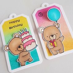 two tags with teddy bears holding a birthday cake and balloon on them, one has a happy birthday card