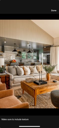 a living room with couches, chairs and a coffee table in front of a window