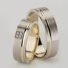 two wedding rings with diamonds on them