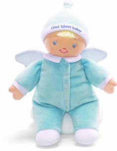 a baby doll wearing a blue outfit with angel wings on it's head, sitting in front of a white background